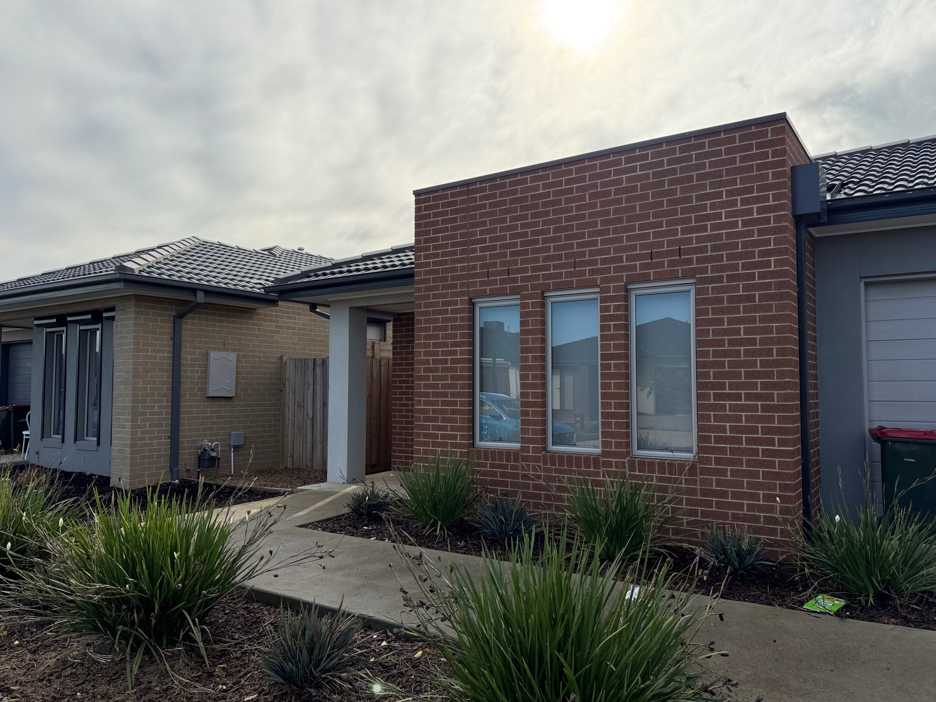 Modern single-storey brick home in Wyndham Vale with landscaped front garden