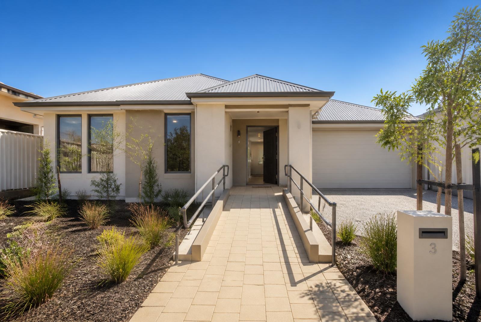 Modern single-storey Perth home with ramped level entry and wide paved pathway