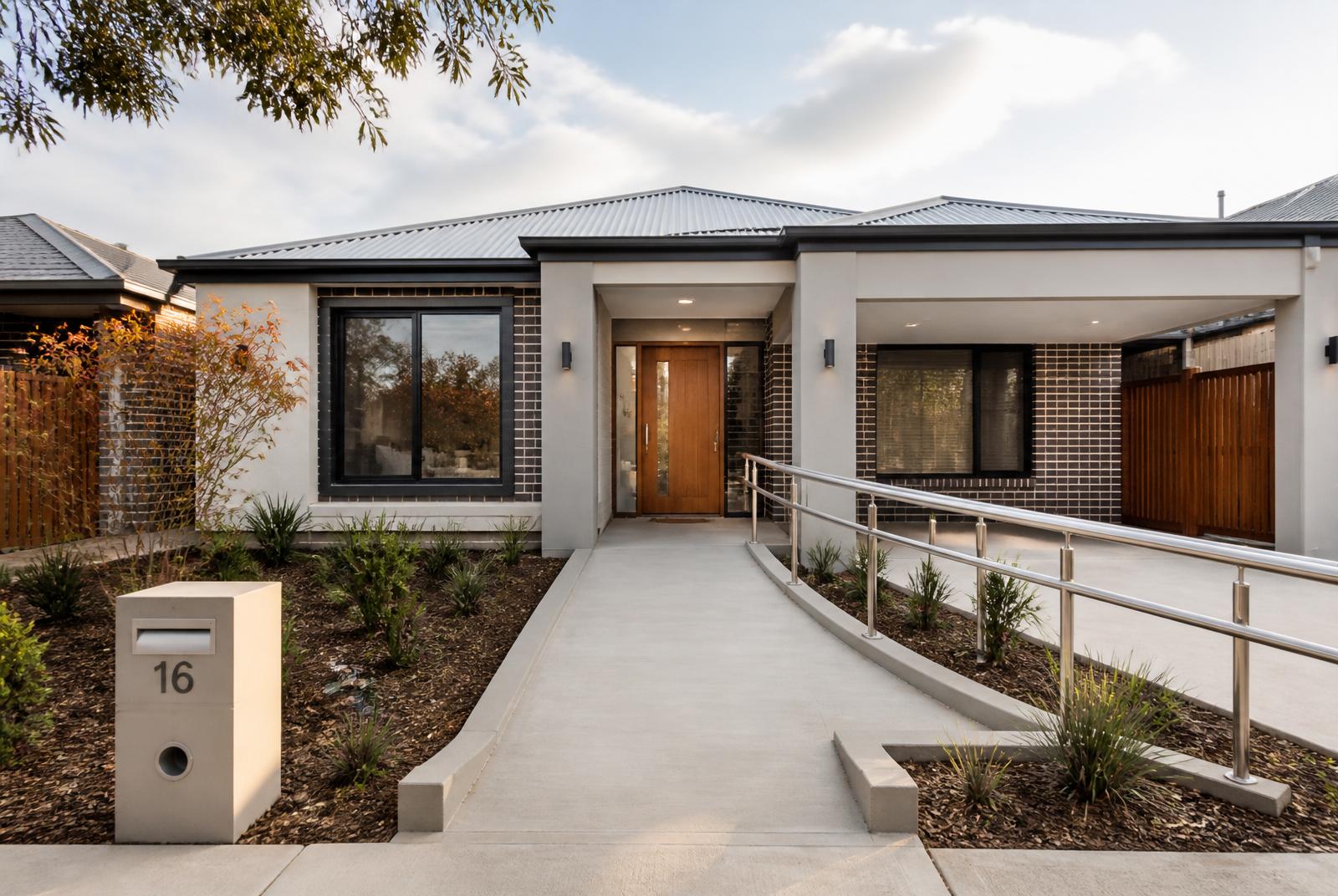 Modern single-storey Heidelberg home with gentle ramp, level entry and wide concrete pathway