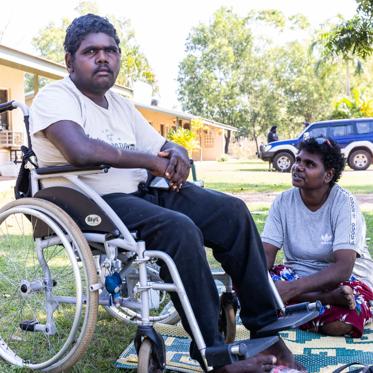 Participant being assisted out of an accessible van